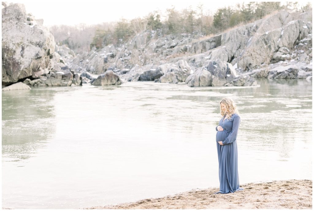 pregnant mother along the banks of a river

