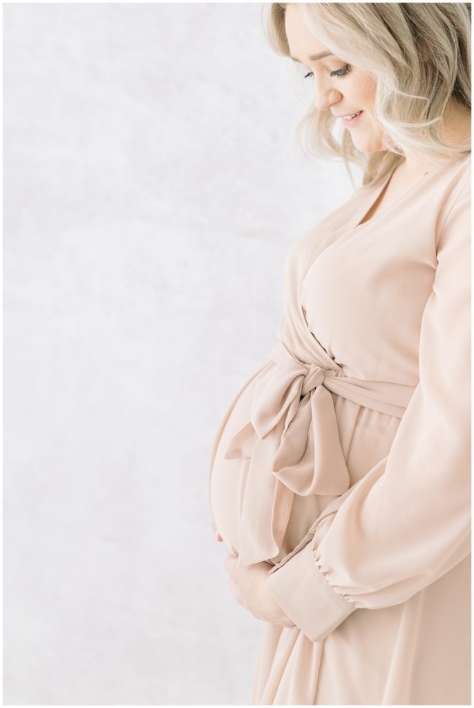 pregnant woman in a pink dress

