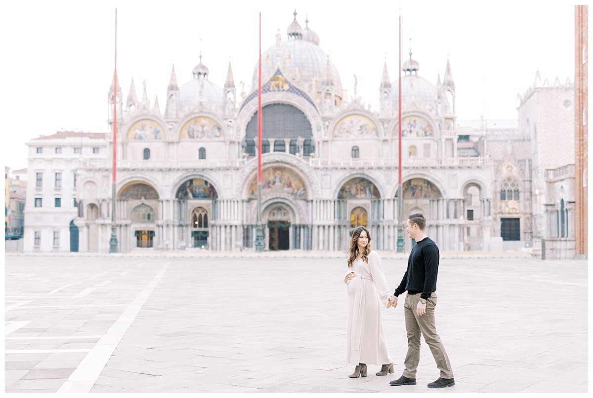 couple in Piazza San Marco during their Venice babymoon
