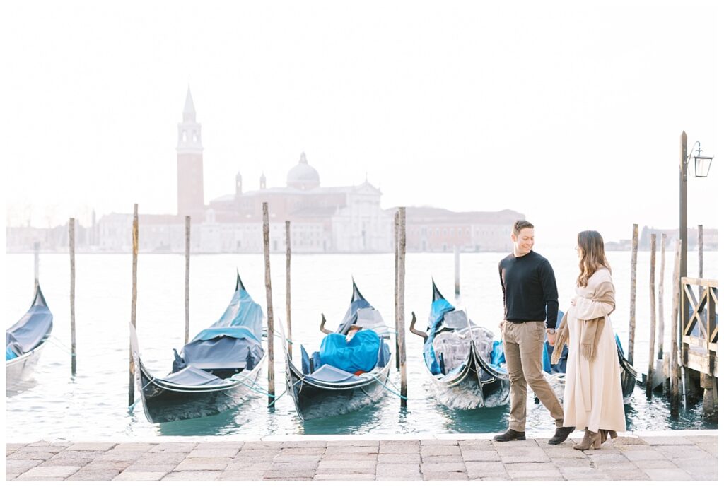 couple in front of Church of San Giorgio Maggiore during their babymoon in venice