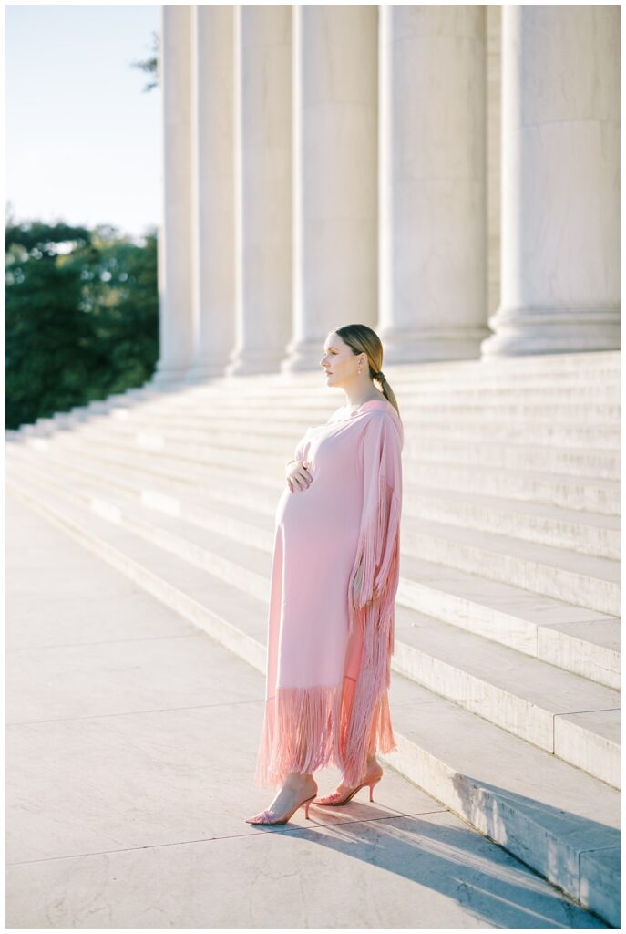 expectant mother in pink designer gown
