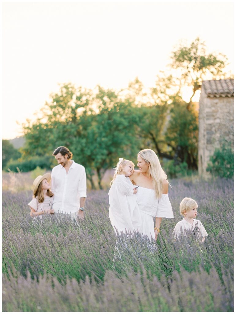 family enjoying the lavender fields in bloom in provence
